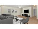 Inviting living room with neutral carpet, couch, chair, and contemporary decor, creating a cozy and modern atmosphere at 526 Elm Ave, Wake Forest, NC 27587