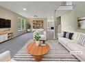 Bright and airy living room featuring modern furnishings and ample natural light at 6 Heatherford Ct, Durham, NC 27704