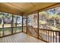 Relaxing screened porch overlooking wooded area at 15 Rolling Meadows Ln, Chapel Hill, NC 27517