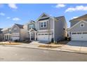 Attractive home with a two-car garage and well-maintained landscaping, showcasing its curb appeal at 504 Morning Glade St, Wake Forest, NC 27587