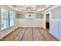 Spacious dining room with elegant chandelier, decorative molding and natural light from large window at 2625 Silver Gate Ct, Wake Forest, NC 27587