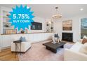 Bright living room featuring built-in shelves, fireplace, and sophisticated decor offers comfort at 1409 Sedgefield St, Durham, NC 27705