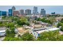 Aerial view showcasing the property's proximity to the city skyline and lush green surroundings at 511 S Bloodworth St # 103, Raleigh, NC 27601