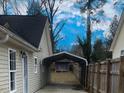 View through carport, showing backyard and shed at 806 Piper St, Durham, NC 27704