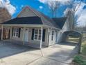 Front view of a charming house with a carport at 806 Piper St, Durham, NC 27704