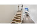 Beautiful staircase with hardwood steps and white risers leading to the upper level at 8204 Yaxley Hall Dr, Raleigh, NC 27616