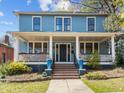Beautiful two-story home with a spacious front porch, columns, and well-maintained landscaping at 417 Elm St, Raleigh, NC 27604