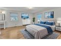 Bright bedroom with hardwood floors, serene decor, and plenty of natural light at 503 Marshall Way, Durham, NC 27705