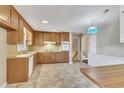 Classic kitchen with wood cabinets and tile flooring at 503 Marshall Way, Durham, NC 27705