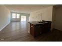 Spacious living room featuring lots of natural light and modern finishes at 126 Parker Ln, Mebane, NC 27302