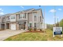 New home with tidy landscaping, visible signage and ample parking. Great location and curb appeal at 1831 Hinesley Dr, Durham, NC 27703