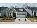 Charming new construction home with a two-car garage, manicured landscaping, and modern architectural details at 2021 Abbeyhill Dr # 66, Raleigh, NC 27610