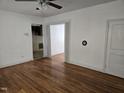 Inviting living room boasts hardwood floors and an open doorway to another living space at 2219 Fitzgerald Ave, Durham, NC 27707