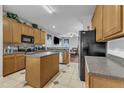 Well-lit kitchen with ample counter space, cabinetry, stainless steel appliances, and an eat-in breakfast area at 3236 Forest Mill Cir, Raleigh, NC 27616