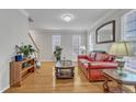 Inviting living room with hardwood floors, neutral walls, and classic furniture arrangement at 3236 Forest Mill Cir, Raleigh, NC 27616