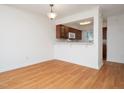Bright dining area with wood flooring and breakfast bar at 7124 Longstreet Dr # B, Raleigh, NC 27615