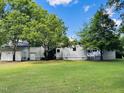 Large, well-maintained backyard with lush greenery, offering ample space and privacy at 135 Weatherbend, Pittsboro, NC 27312