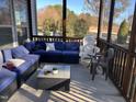 Cozy screened porch with comfortable seating area perfect for outdoor relaxation at 374 W Falcon Ct, Clayton, NC 27520