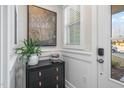 Stylish entryway features a modern cabinet, elegant artwork, and a bright window with classic white trim at 211 Pond View Ct # 5, Fuquay Varina, NC 27526