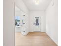 Bright hallway with neutral paint, wood floors, and natural light at 3301 Oakfields Rd # 2, New Hill, NC 27562