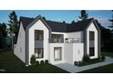 Contemporary home with dark framed windows, a second story balcony, white brick facade, and gray siding at 60 Chestnut Oak Dr, Youngsville, NC 27596