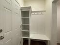 The mudroom includes a custom shelving and a coat rack with bench at 482 Traditions Grande Blvd # 30, Wake Forest, NC 27587
