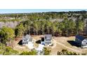 Panoramic aerial view showcasing the property's location amidst a lush forest landscape at 806 Roberts Rd, Sanford, NC 27332