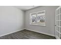 Bright office space with a large window and stylish wood-look flooring at 98 Ethel Ln, Angier, NC 27501