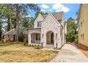 Charming new construction home featuring brick facade and arched entryway at 3302.5 Hall Pl, Raleigh, NC 27607