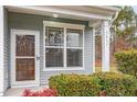Home exterior featuring a front door, large window, front porch, and house number at 3417 Cardinal Lake Dr, Durham, NC 27704