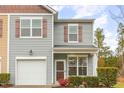 Lovely two-story home with vinyl siding, shutters, and a front-facing attached garage at 3417 Cardinal Lake Dr, Durham, NC 27704