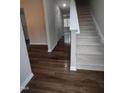 Bright entryway with hardwood floors and staircase leading upstairs at 788 Roberts Rd, Sanford, NC 27332