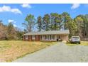 Charming single-story home with brick facade and an attached car port at 2169 Northcrest Dr, Elon, NC 27244