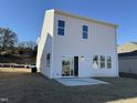 Backyard featuring a sliding glass door leading to a concrete patio at 350 Tormore, Homesite 126, Sanford, NC 27330