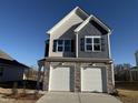 Charming two-story home with a two-car garage and stone accents at 350 Tormore, Homesite 126, Sanford, NC 27330