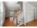Welcoming entryway with hardwood floors, staircase, and views into the spacious living areas at 4324 Brighton Ridge Dr, Apex, NC 27539