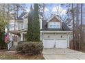 Inviting home with two-car garage, manicured lawn, covered porch, and American flag at 4324 Brighton Ridge Dr, Apex, NC 27539