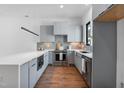 Stylish kitchen featuring modern appliances, sleek cabinetry and light countertops at 512 Gordon Street # 602, Durham, NC 27701