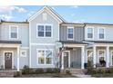 Charming two-story townhouse with a covered porch and neat landscaping at 728 Silo Park Dr, Wake Forest, NC 27587