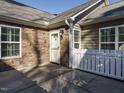 Front entrance with stone detailing and a white picket fence at 992 Blue Bird Ln, Wake Forest, NC 27587