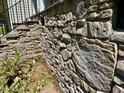 Close-up of the home's exterior stone foundation wall at 19 Covey Rise Way, Lillington, NC 27546