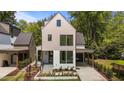 Contemporary home boasting clean lines, neutral color palette, and thoughtfully designed landscaping at 339 1/2 Mulberry St, Raleigh, NC 27604