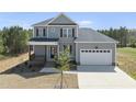 Beautiful two-story home boasting a two-car garage, covered front porch, and a neatly landscaped front yard at 40 Misty Mountain, Spring Hope, NC 27882