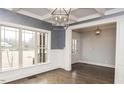 Bright dining room with hardwood floors, and large windows at 6737 Dwight Rowlad Rd, Willow Springs, NC 27592