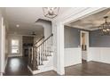 Elegant entryway with staircase, hardwood floors, and high ceilings at 6737 Dwight Rowlad Rd, Willow Springs, NC 27592
