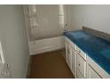Clean bathroom with white cabinetry, modern fixtures, and shower-tub combination at 114 Arundel Dr, Archer Lodge, NC 27527