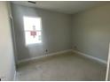 Bright bedroom with large window providing ample natural light at 114 Arundel Dr, Archer Lodge, NC 27527