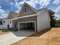 Charming new construction home featuring stone accents, a two-car garage, and a welcoming covered front porch at 114 Arundel Dr, Archer Lodge, NC 27527