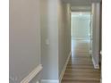 Inviting hallway with light gray walls and wood-look flooring leading into the home at 114 Arundel Dr, Archer Lodge, NC 27527