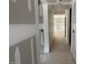 An open hallway with unfinished walls leading to other rooms in the new construction home at 114 Arundel Dr, Archer Lodge, NC 27527
